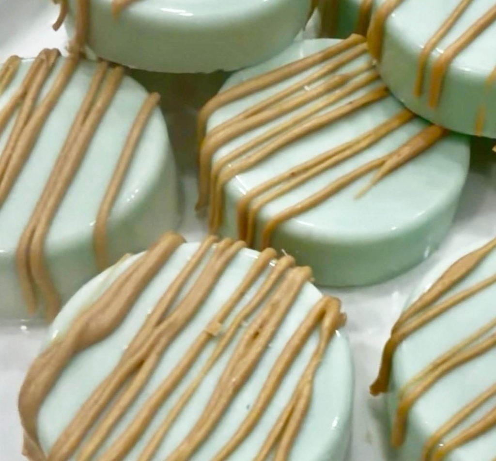 peanut butter ritz crackers dipped in tinted white chocolate